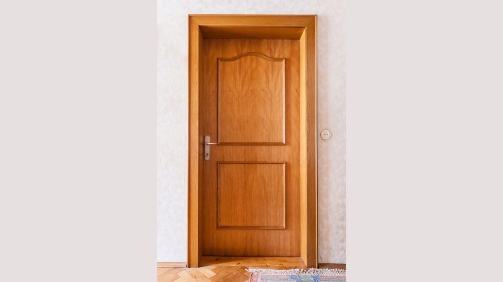 composite door finished with furnished wood panels in a panel door design