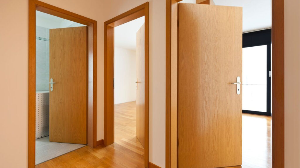 interior doors with wooden hinges and matching wood veneer