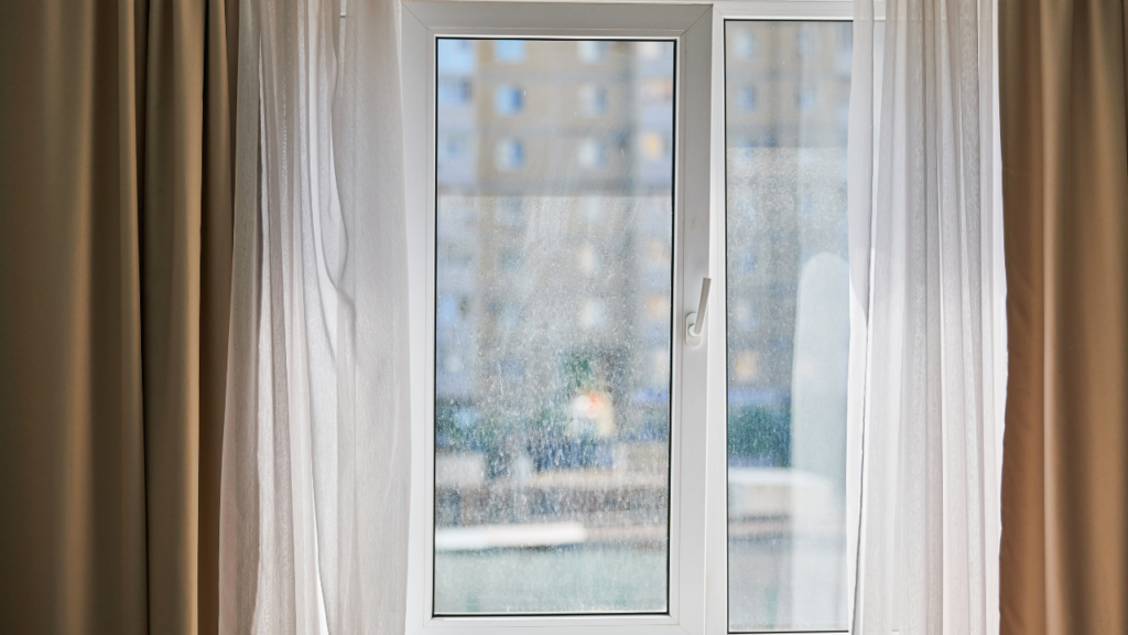 A window with a dirty glass screens