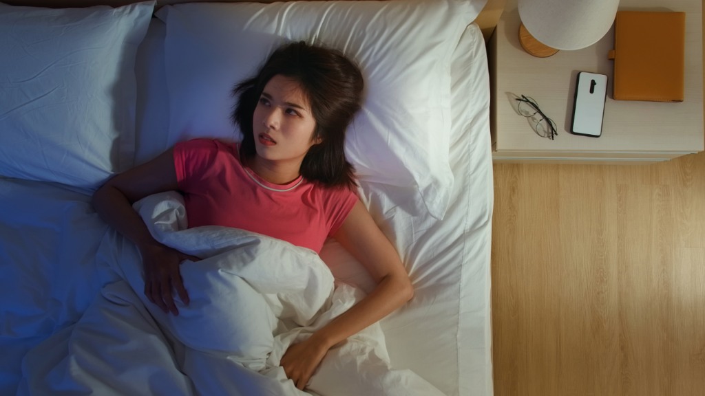 A woman who can’t sleep because of the noise coming through the broken windows